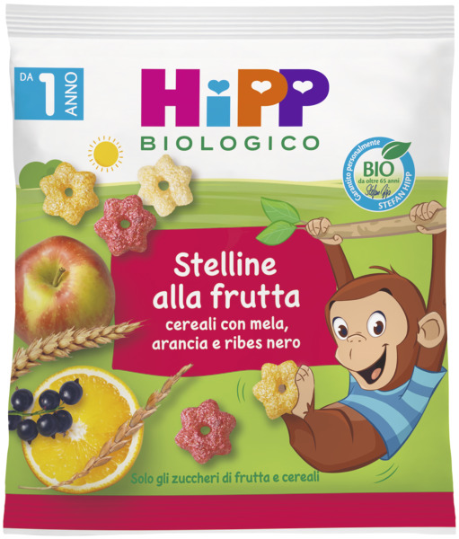 Una colorata confezione alimentare mostra un allegro elefante, una varietà di frutta e cereali a forma di stella, con il testo "Stelline di Cereali alla frutta", che indica le stelle di cereali al gusto di frutta.